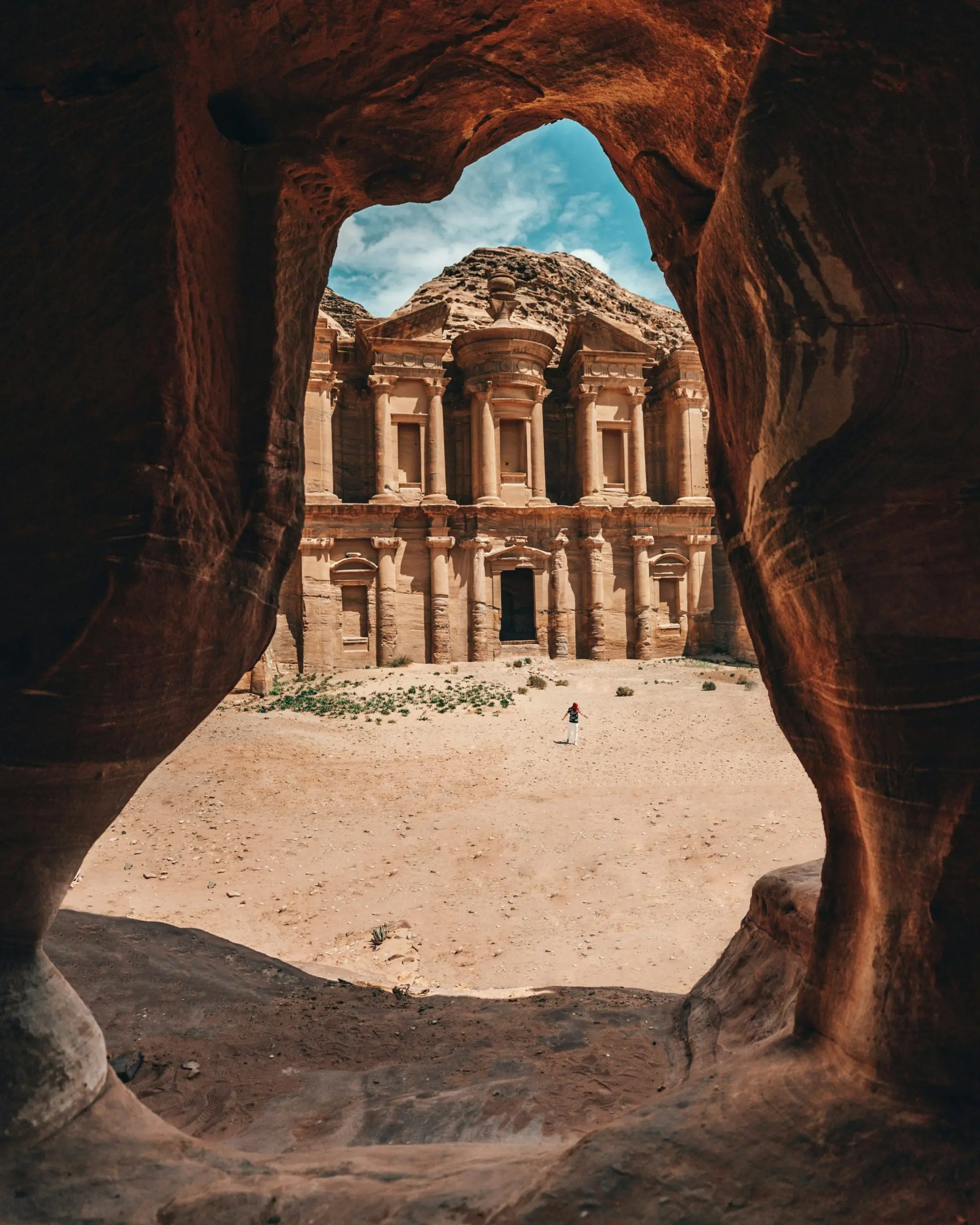 Ancient rose rock facade carved into cliff in Petra Jordan desert